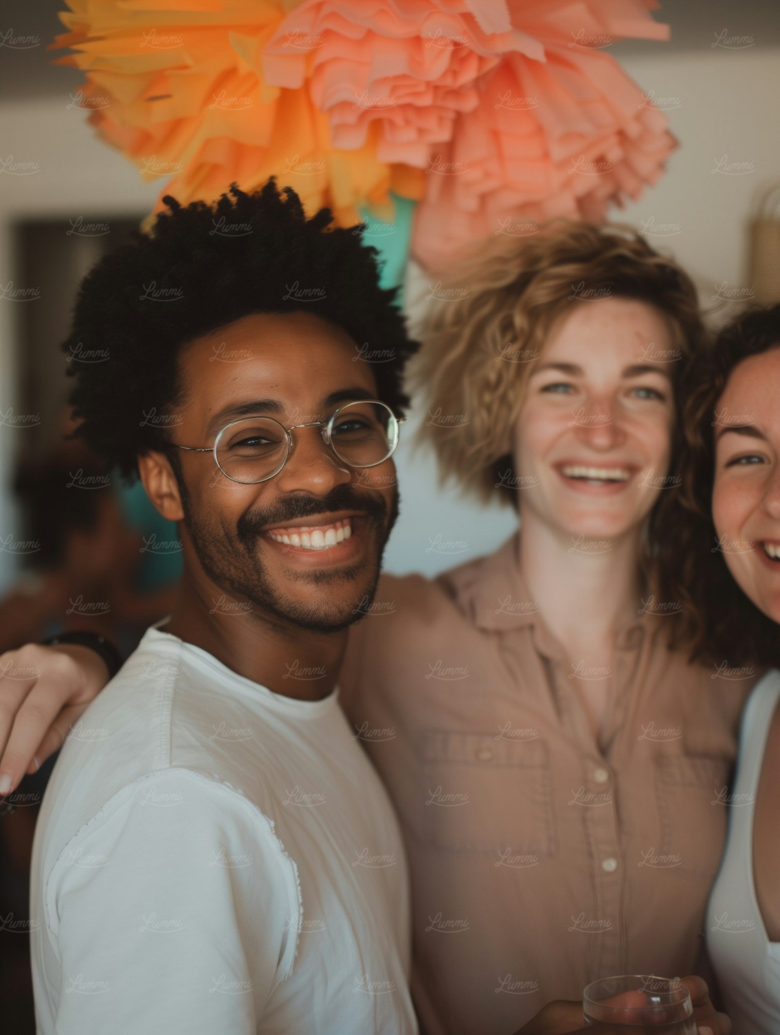 A diverse group of individuals embracing each other, symbolizing the strong theme of 'found family' and belonging that resonates in Maas's stories.