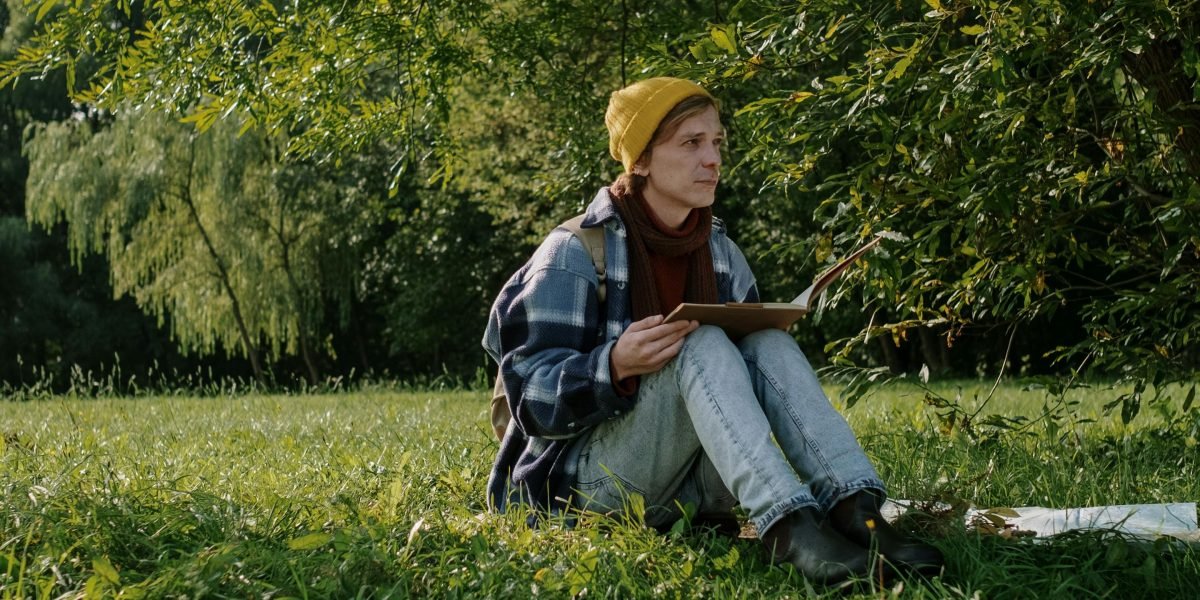 A person relaxing and enjoying a good book, highlighting the simple pleasure of discovering a story that matches one's preferences.