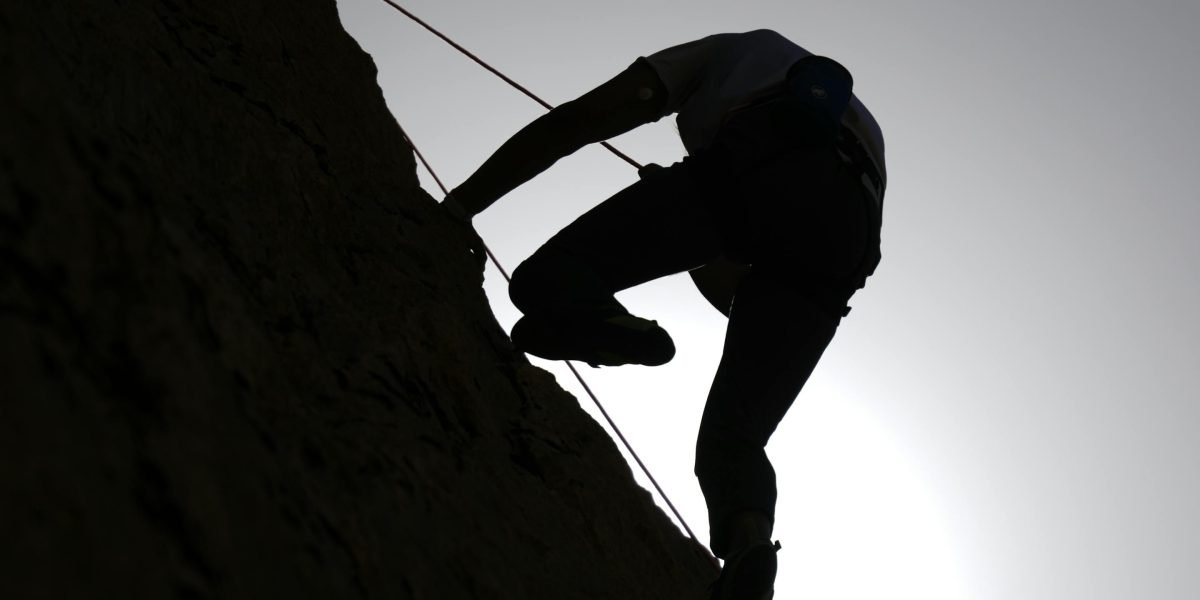 A determined young person overcoming obstacles with resilience.