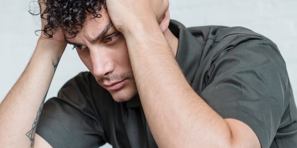 A person contemplating too many options, struggling to make a decision.