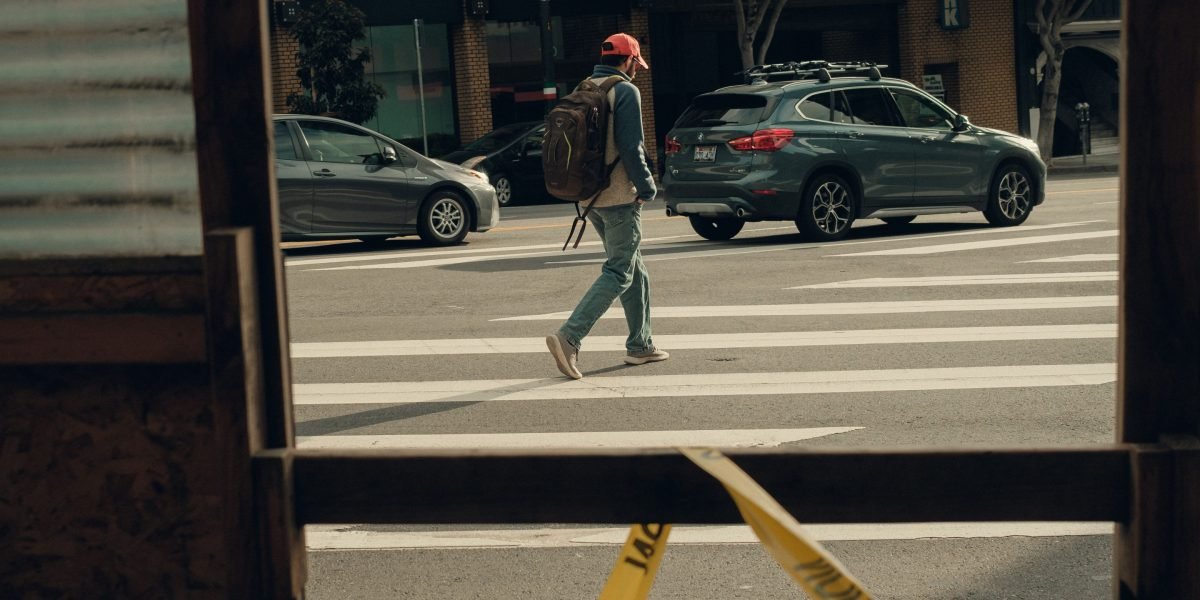 A person observing their surroundings in a bustling city with a hint of curiosity.