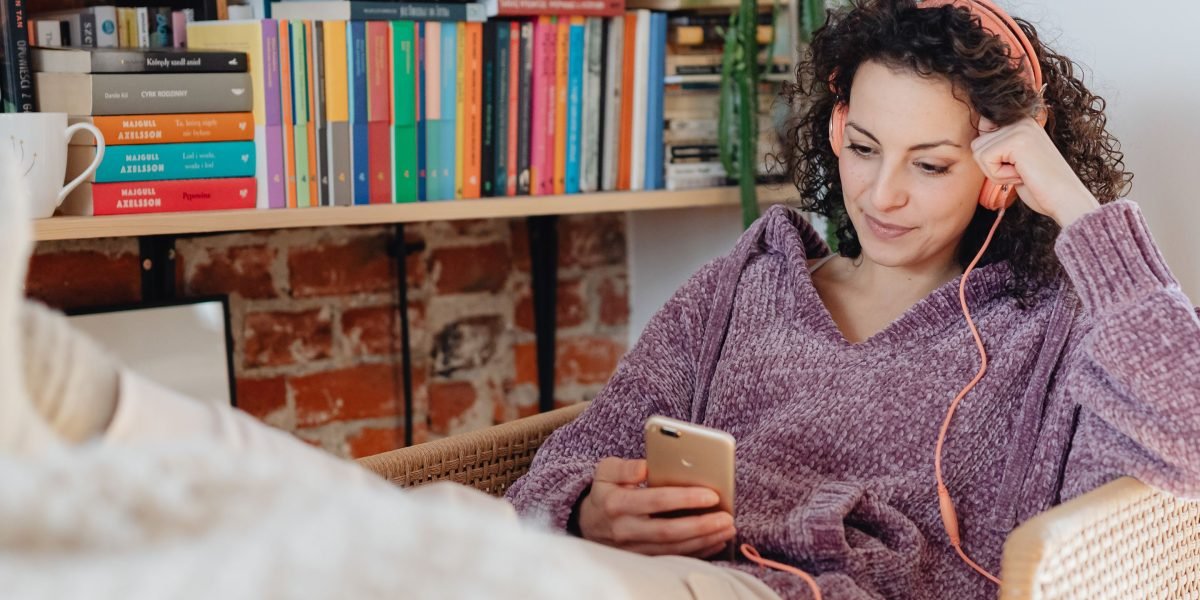 A person comfortably relaxing while listening to an audiobook, demonstrating the ease and flexibility of enjoying classic stories anywhere.