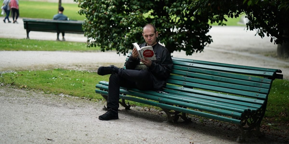 A reader deeply engrossed in a book, highlighting the immersive experience of a great story.