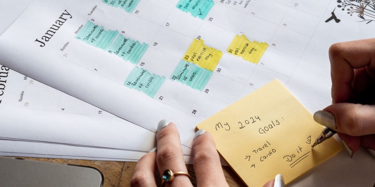 A person organizing their reading list or making notes about their book discovery goals.